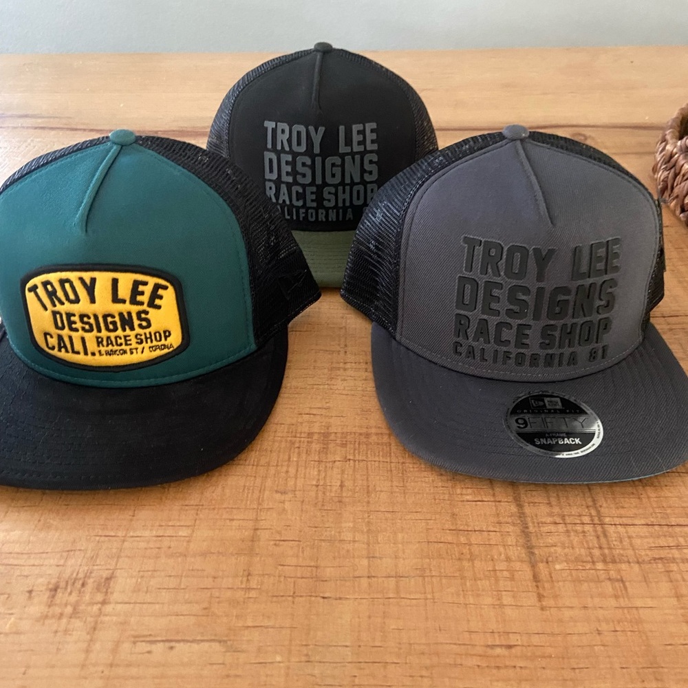 Grey and green tld hats